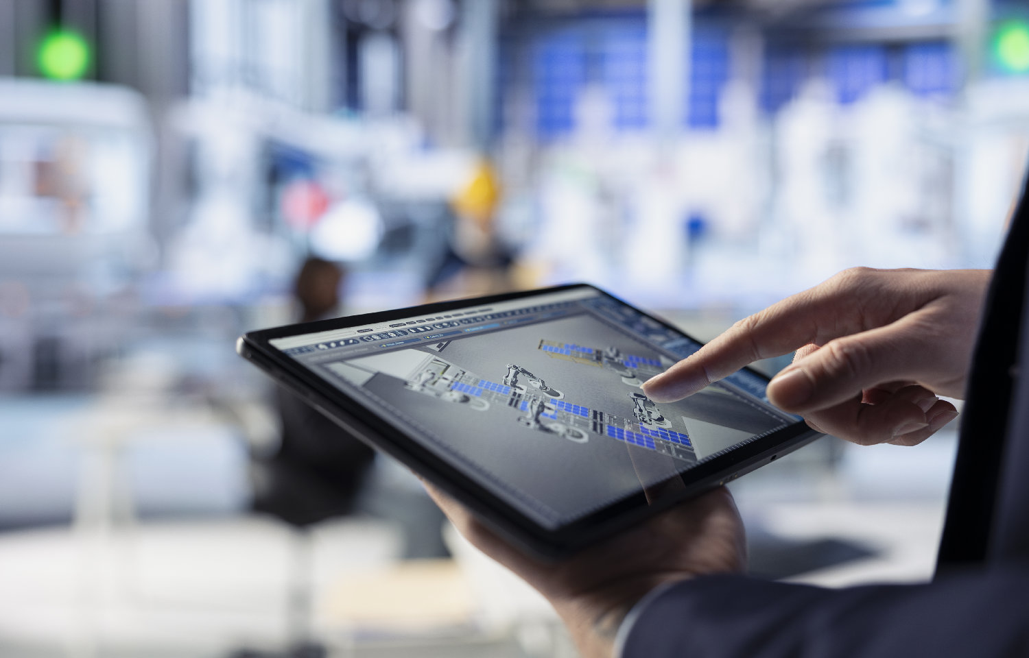 Technician in photovoltaics factory uses tracking software on tablet to review performance of robot arms manufacturing solar panels. Specialist uses device to inspect solar plant machinery, closeup